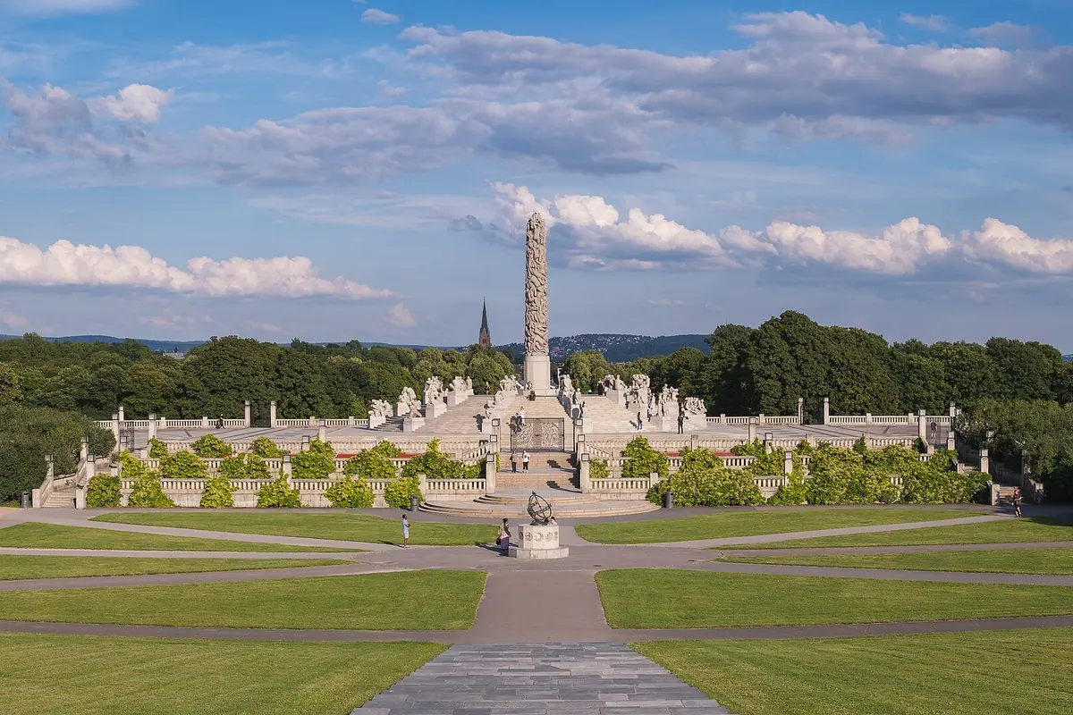 The Vigeland installation on a summer afternoon: lawns and paths leading up to the granite Monolith and its surrounding sculptures.